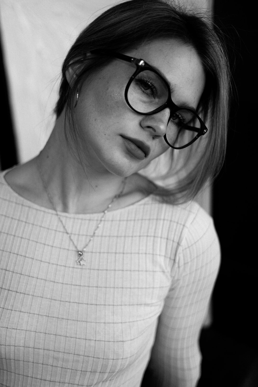 Studio portrait of a woman with glasses