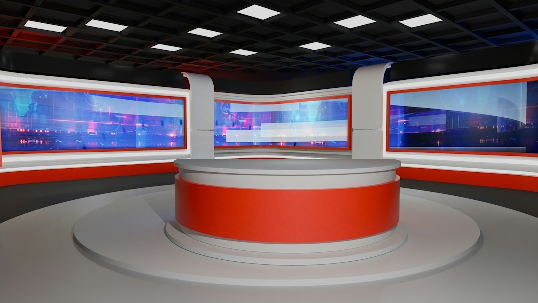 Television news studio with cameras and desk