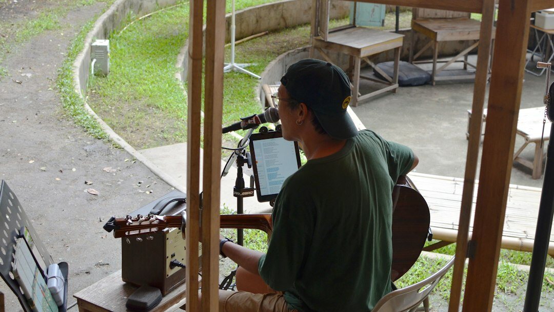 Producer reviewing a live broadcast feed on a tablet